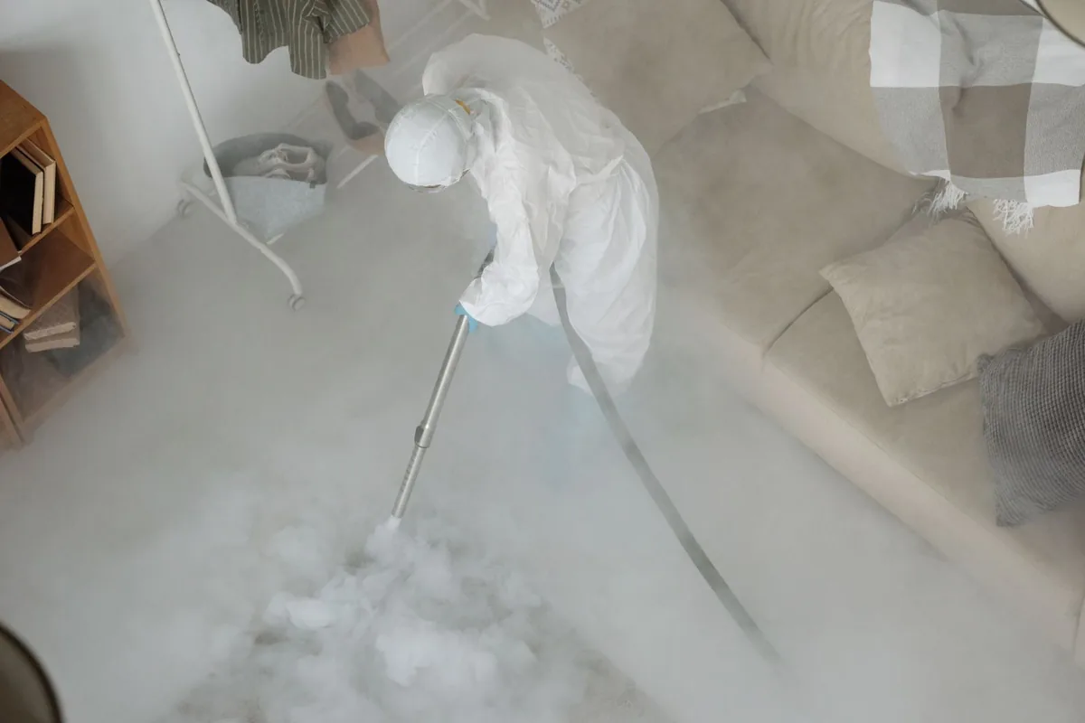 Biohazard cleanup technician in protective equipment, Southeast Seminole Heights, Tampa, FL